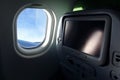 Airplane seat with tv screen Royalty Free Stock Photo