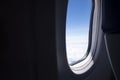 Airplane seat and window inside an aircraft Royalty Free Stock Photo