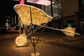 Airplane-shaped illuminated Christmas sculpture in the street in Magdeburg, Germany at night