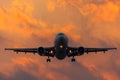 Airplane silhouette landing airport in the evening at sunset, the sky and picturesque clouds.