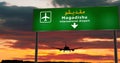 Plane landing in Mogadishu Somalia airport with signboard