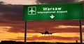 Plane landing in Warsaw Poland with signboard