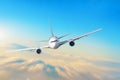 Airplane in the sky above the clouds flight journey sun height speed motion blur. Royalty Free Stock Photo