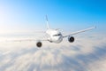 Airplane in the sky above the clouds flight journey sun height speed motion blur. Passenger commercial aircraft. Business travel. Royalty Free Stock Photo