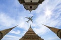 Airplane on the sky over Thailand grand palace