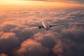 An airplane soaring through the sky above a sea of clouds during a stunning sunset, Flying above the Clouds at dawn, AI Generated Royalty Free Stock Photo