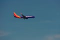Airplane from Southwest Airlines, is landing at Orlando Airport on beatiful blue sky backround