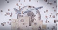 Airplane and stack of cardboard boxes over network of profile icons against globe on grey background Royalty Free Stock Photo