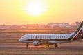 Airplane on a starting runway evening sundown Royalty Free Stock Photo