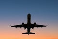 Airplane on sunset sky , aircraft silhouette scenic sky Royalty Free Stock Photo