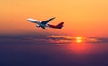 Airplane in the sunset sky flight travel transport airline background Royalty Free Stock Photo