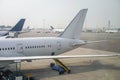 Airplane tail view at the airport. Royalty Free Stock Photo