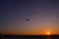 Airplane take off on sunset. Golden sunset at the airport. Twilight sky sunset. Macau Airport Royalty Free Stock Photo