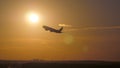 Airplane takeoff at sunset