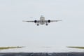 Airplane taking off from airport runway Royalty Free Stock Photo