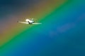 Airplane taking off at the airport sky and rainbow rain Royalty Free Stock Photo