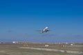 Airplane taking off from the airport. White Passenger plane fly up over runway from airport. Commercial passenger airplane takes