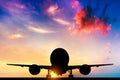 Airplane taking off at sunset Royalty Free Stock Photo