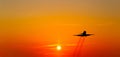 Airplane taking off at sunset. Silhouette of a big passenger or cargo aircraft, airline. Transportation Royalty Free Stock Photo