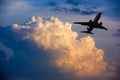 Airplane taking off at sunset. Silhouette of a big passenger or cargo aircraft, airline. Transportation Royalty Free Stock Photo