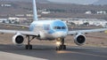 Airplane taxiing on the runway. Boeing 757-204 with plate G-BYAY, TUI Airways