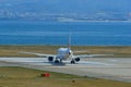 Airplane Taxiing On Runway Of Kansai Airport