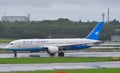 Airplane taxiing on runway of Tokyo Narita Airport