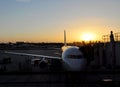 Airplane taxing and sunset