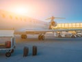 Airplane at the terminal gate ready for takeoff - Modern international airport during sunrise - Concept travel around the world Royalty Free Stock Photo