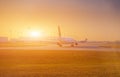 Airplane at the terminal gate ready for takeoff - Modern international airport during sunrise - Concept travel around the world Royalty Free Stock Photo