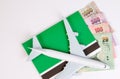 Airplane on Thai money, the rising costs of airline travel. Royalty Free Stock Photo