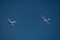 An airplane towing a glider on a rope Royalty Free Stock Photo