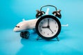 Airplane toy with alarm clock on blue Royalty Free Stock Photo