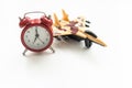 Airplane toy with alarm clock on blue. Time to flight. Royalty Free Stock Photo