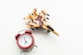 Airplane toy with alarm clock on blue. Time to flight. Royalty Free Stock Photo