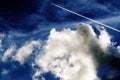 Airplane trace in Cloudy Sky Royalty Free Stock Photo