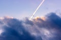 Airplane trail in the cloud and blue sky. Royalty Free Stock Photo