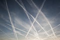 Airplane trails of condesed air in the sky Royalty Free Stock Photo