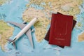 Airplane and two passports travel documents Royalty Free Stock Photo