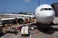 Airplane Unloading the Luggages at the Airport Royalty Free Stock Photo