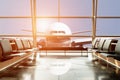 Airplane view from airport lounge in airport terminal. Royalty Free Stock Photo