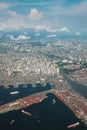 Airplane view of the City of Manila. Capital of Philippines from above. Manila bay, ships, port, Pasig River, buildings below.