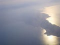 Airplane view of the Sicily Island. Beautiful blue sky with sea view from the plane. View of Italian island Royalty Free Stock Photo