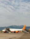 Airplane is waiting on board with mountains view. Plane landed Royalty Free Stock Photo