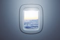 Airplane window with beautiful sky view. Travel and transportation concept. Royalty Free Stock Photo