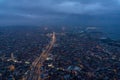 Airplane window from interior of aircraft with view of complex highway