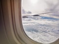 Airplane window view cloud sky aircraft wing Royalty Free Stock Photo