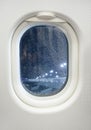 Airplane window view at night with raindrop Royalty Free Stock Photo