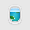 Airplane Window with a View of a Tropical Island Ocean.