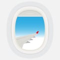 Airplane windows with cloudy blue sky outside. Royalty Free Stock Photo